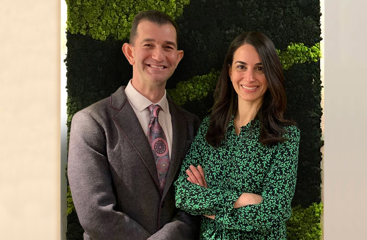 Image showing Dr. Douglas Kraut and Dr. Laila Kafi side by side in their office lobby in front of a live moss wall.